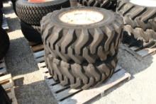 TWO TITAN 15X19.5 TIRES WITH 8 BOLT RIMS