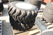 TWO TITAN 15X19.5 TIRES WITH 8 BOLT RIMS (UNUSED)