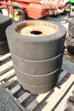 FOUR HARD TIRES TO FIT SKID STEERS WITH 8 BOLT RIMS