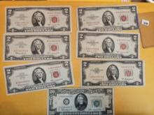 Seven pieces of older currency