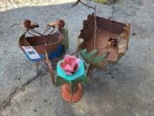 (2) Metal Wheel Barrels, and (1) Metal Pink Flower