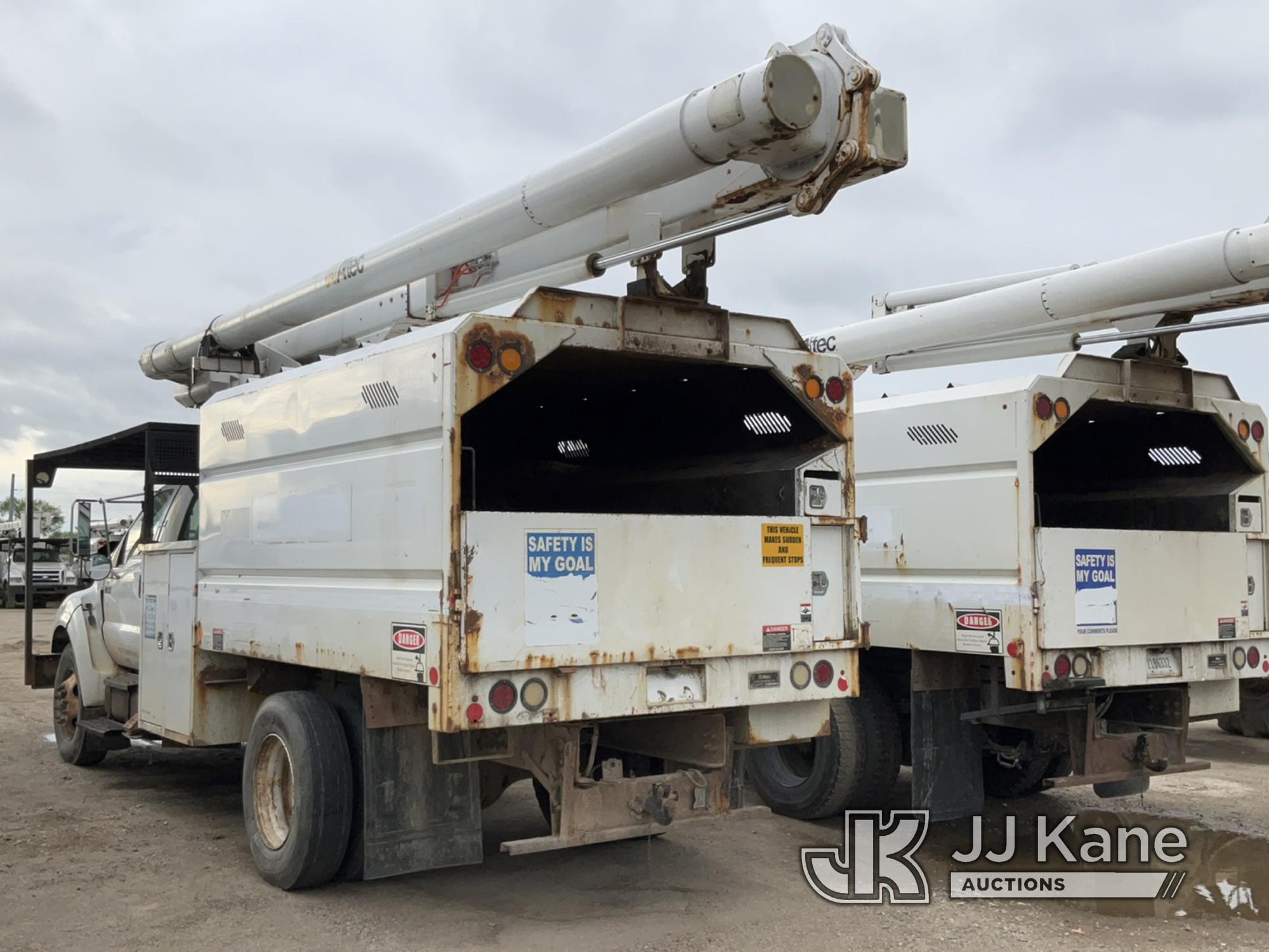 (Charlotte, MI) Altec LRV55, Over-Center Bucket Truck mounted behind cab on 2010 Ford F750 Chipper D