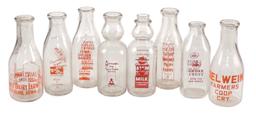 Country Store Milk Bottles & Carrier, 8 diff enameled glass bottles from Io