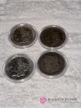 set of four silver dollars