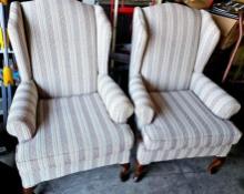 Pair of cushioned side arm chairs
