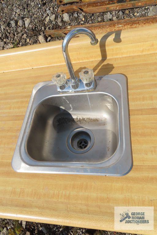 Formica top...countertop with two stainless steel hand sinks