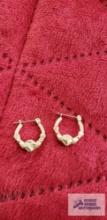 Gold colored Claddagh hoop earrings, one is dented, marked 14K .8 G (Description provided by seller)