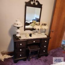 Full size bed, vanity with wall mirror and chest of drawers. On second floor