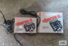two battery chargers with boxes