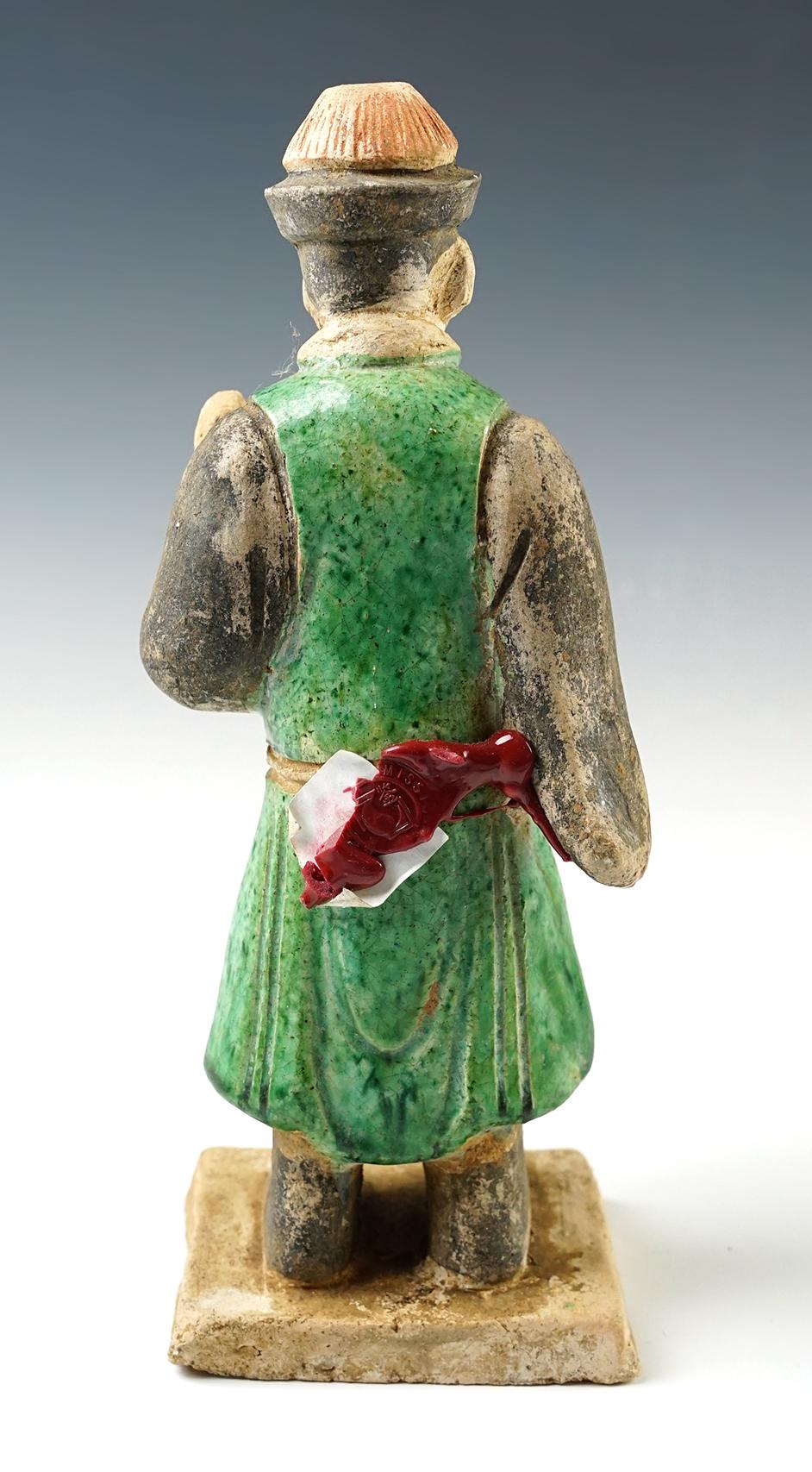 8 " tall Chinese male figure from the Tang Dynasty, cira A.D 618- 907. In excellent condition.