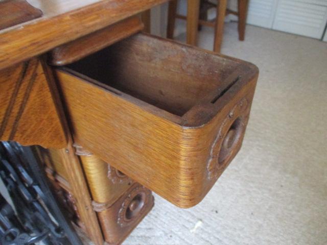 Antique Singer Treadle Sewing Machine in Tiger Oak Cabinet