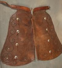 Fine pair of silver spotted bull hide Bat Wing Chaps, maker marked "E.C. Irick, Craig, Colo." Chaps