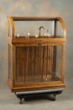 Fine Antique oak curved glass Cane Cabinet, floor model, circa 1890-1900 with brass label marked " G