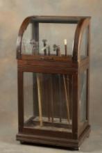 Antique curved glass wooden Cane Cabinet, circa 1900s, holds up to 48 Canes, 48" T x 18" D x 23 3/4"
