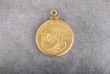 High condition Gold quarter oz. Panda Coin dated 1984 mounted in gold Bezel.