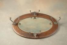 Antique quarter sawn oak oval Hat Rack Hanging Mirror in original finish with four fancy cast iron h