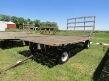 249. FACTORY FOUR WHEEL WAGON WITH 8 X 16 FT. WOODEN FLAT RACK