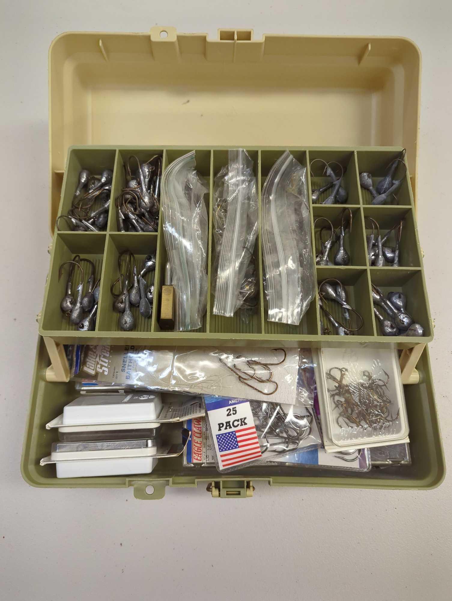 Tackle Box and contents including a variety of fishing hooks. Comes as is shown in photos. Appears