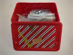 Christmas tote and contents including various worm fishing lures. Comes as is shown in photos.