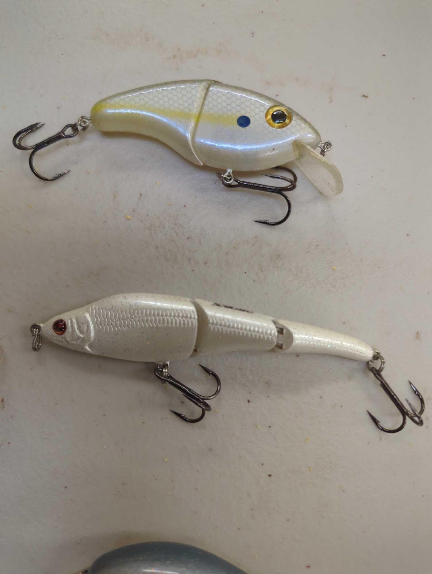 Clear chocolate box of fishing lures of similar style. Comes as is shown in photos. Appears to be