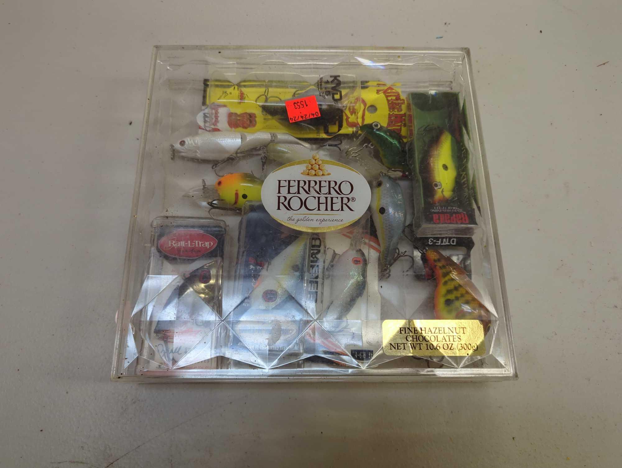 Clear chocolate box of fishing lures of similar style. Comes as is shown in photos. Appears to be