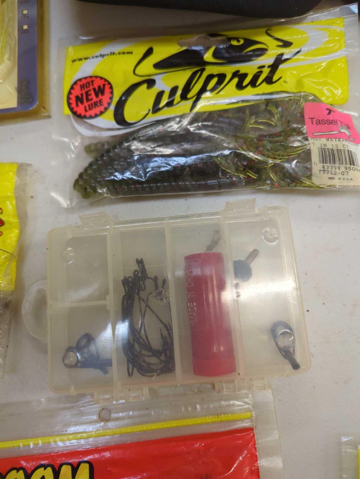 Refrigerator drawer filled with fishing lures and other fishing accessories. Comes as is shown in