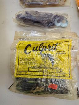 Bag of fishing worm lures and fishing reel. Comes as is shown in photos. Appears to be used.