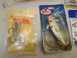 Box and contents including fishing lures and other fishing accessories. Comes as is shown in photos.