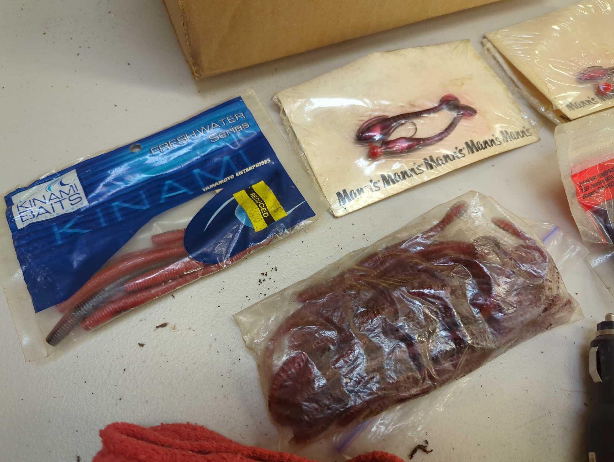 Box of fishing lures, rags, and other fishing gear. Comes as is shown in photos. Appears to be used.