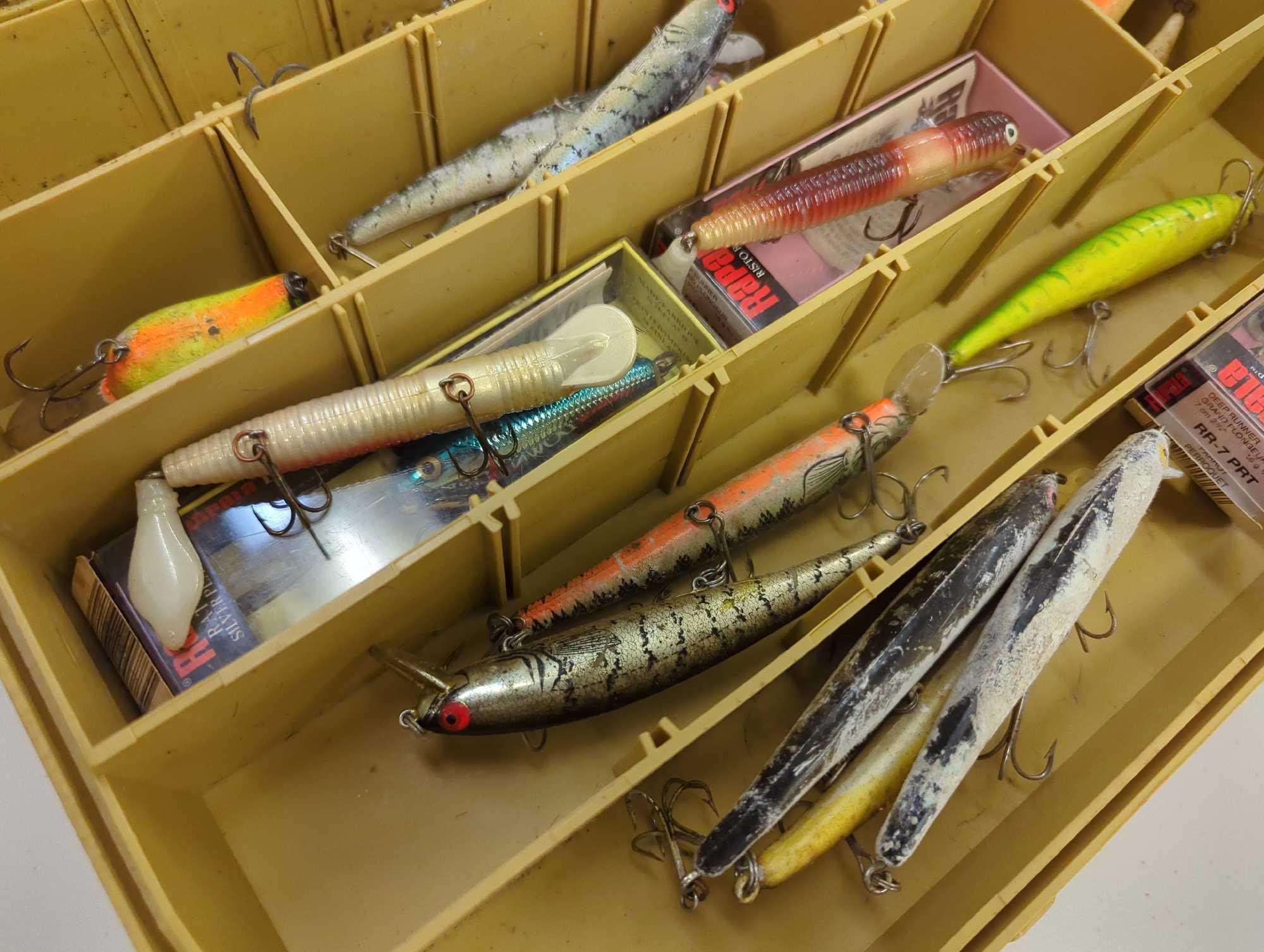 Dual-sided Tackle Box and contents including various fishing lures. Comes as is shown in photos.