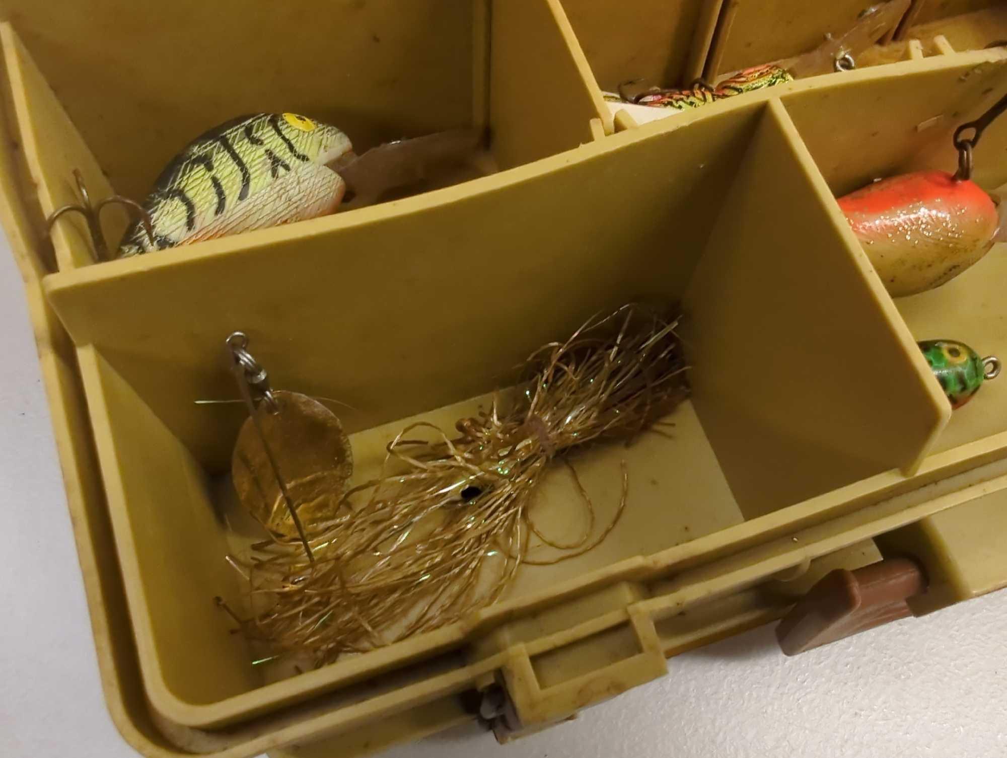 Dual-sided Tackle Box and contents including various fishing lures. Comes as is shown in photos.