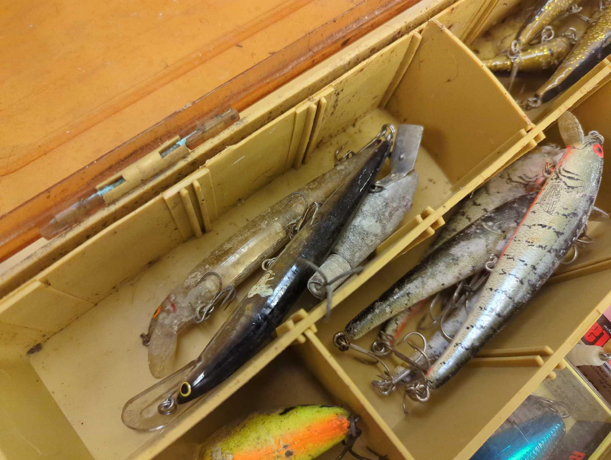 Dual-sided Tackle Box and contents including various fishing lures. Comes as is shown in photos.