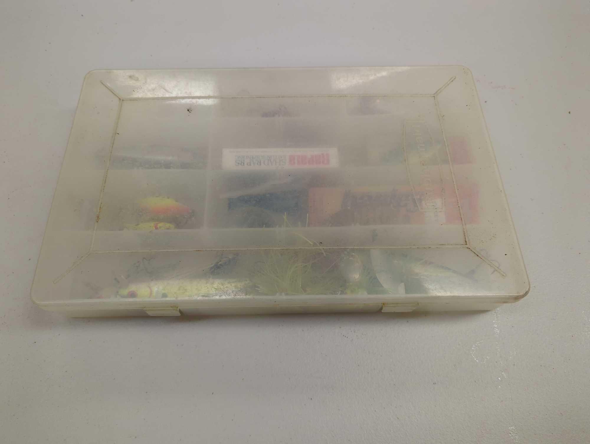 Tackle Box and contents including various fishing lures and other fishing accessories. Comes as is