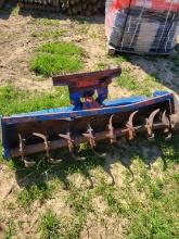 NEW HOLLAND 256 HAY RAKE WITH DOLLY WHEELS