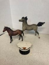 Two horse figurines and a Shell Oil hat bank