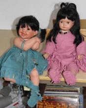 Two Artist-Made Seated Porcelain Native American Baby Dolls