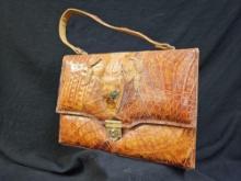 You can be the Lady with the Alligator Purse!