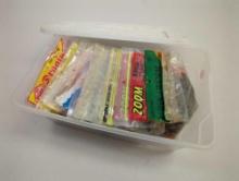White Rubbermaid organizer tote and contents including worms and other packaged fishing lures. Comes